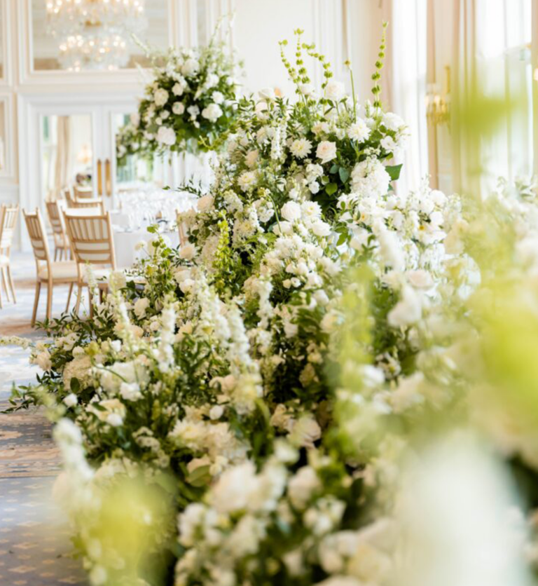 Luxury white wedding floral arrangements with layered textures and greenery by Muse Styling Scotland