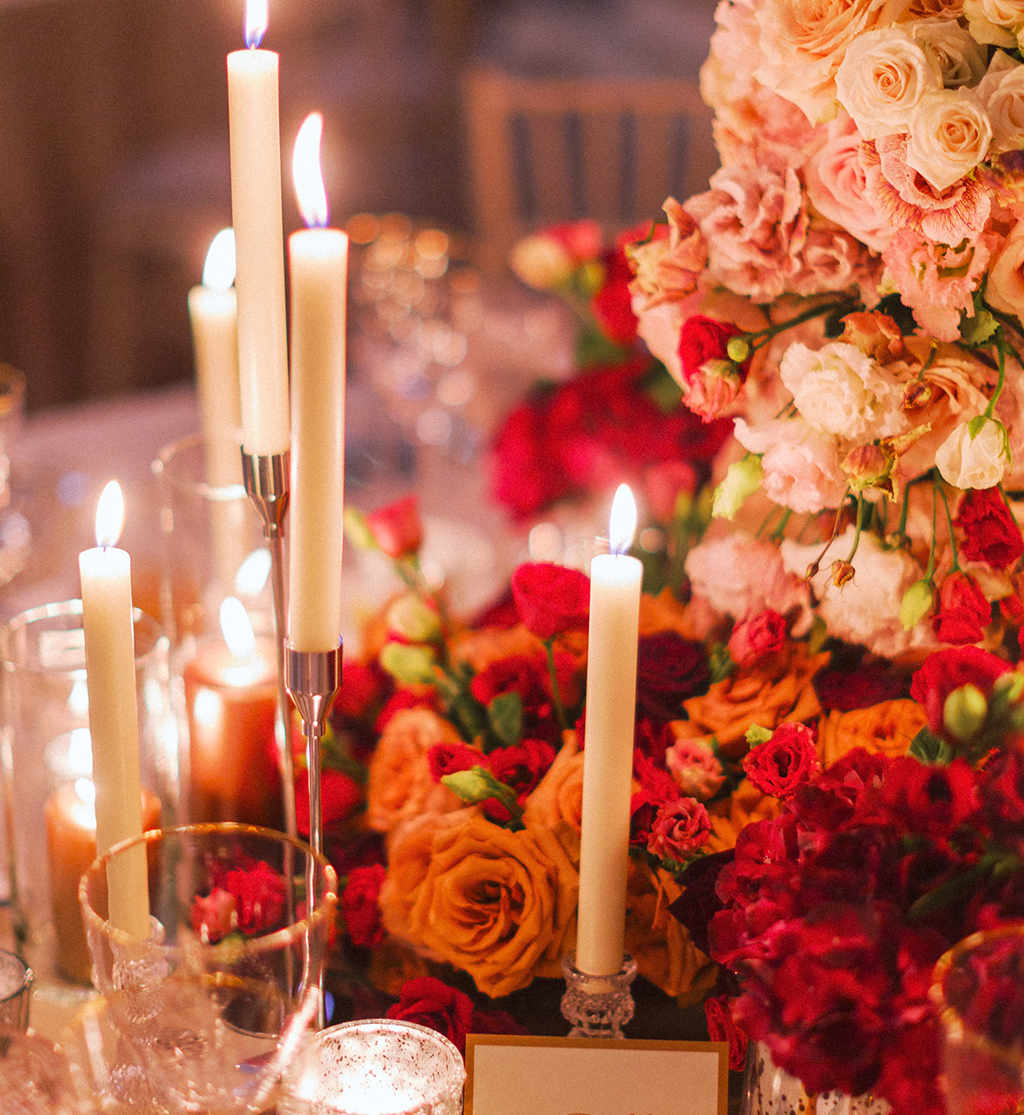 Statement floral installation with roses and candlelight at Gleneagles wedding by Muse Styling