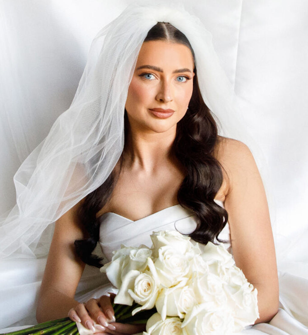 Bride holding white rose bouquet with veil at Cameron House wedding by Muse Styling