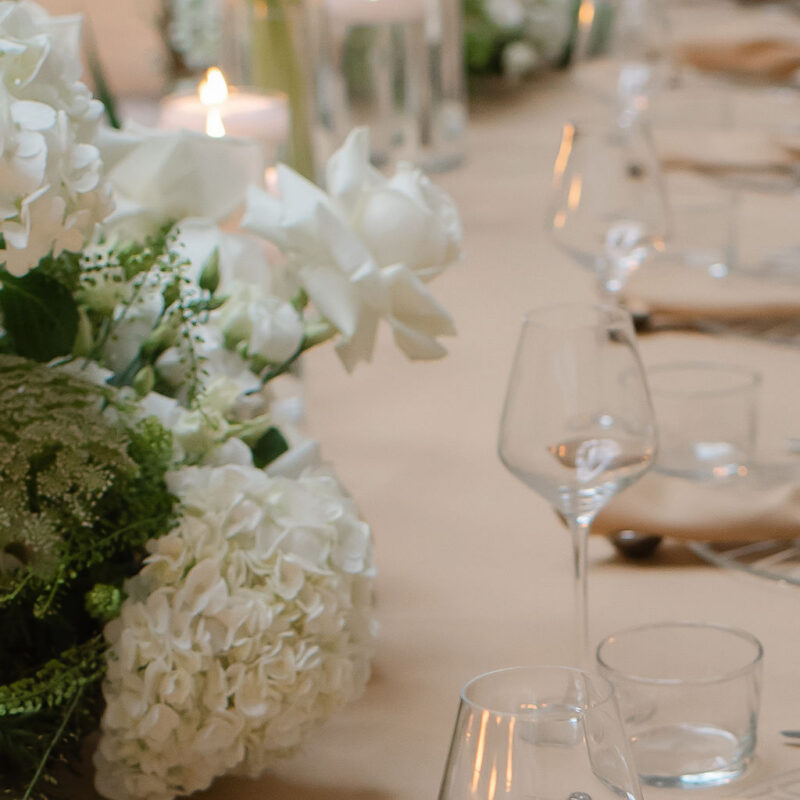 Luxury white floral ceremony styling with elegant aisle arrangements and wedding decor hire by Muse Styling Scotland