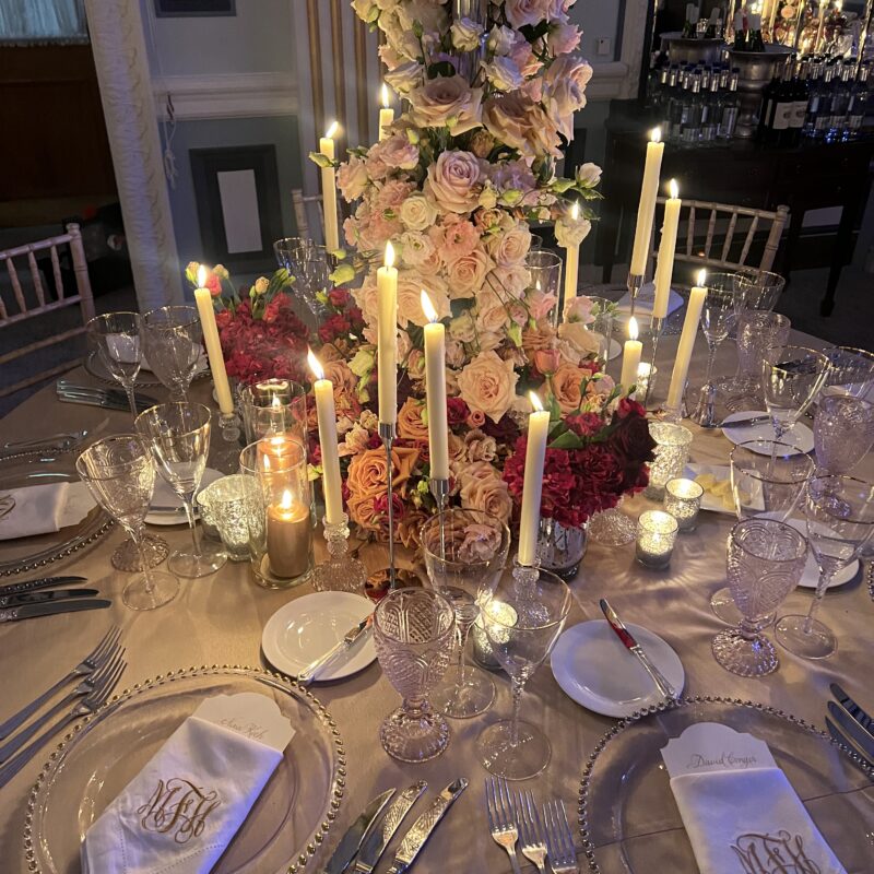 Luxury tall floral centrepiece with blush roses and candlelight on elegant styled reception table by Muse Styling Scotland