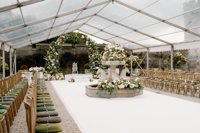 Luxury floral ceremony arch designed by Muse Styling for an American destination wedding at Dundas Castle in Scotland.
